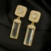 Shehnaai Glow Earrings - Gold & Crystal Danglers